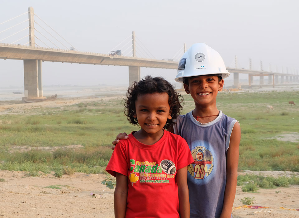 Kids in front of bridge