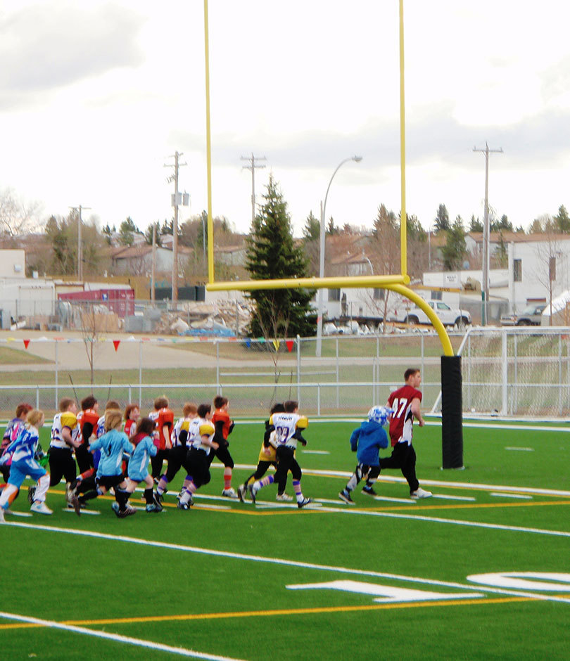 Kids playing on turf