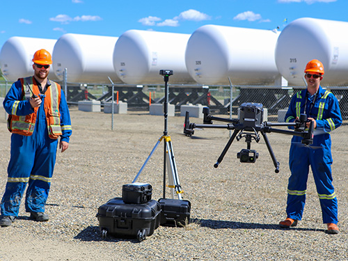 McElhanney staff flying a drone on a project site near Fort St John, BC