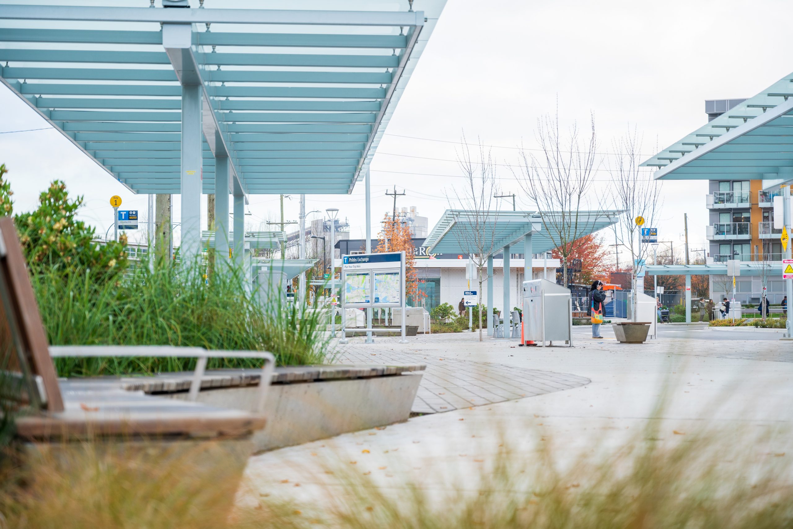 Covered pedestrian walkways and seating areas within the upgraded Phibbs Transit Exchange.