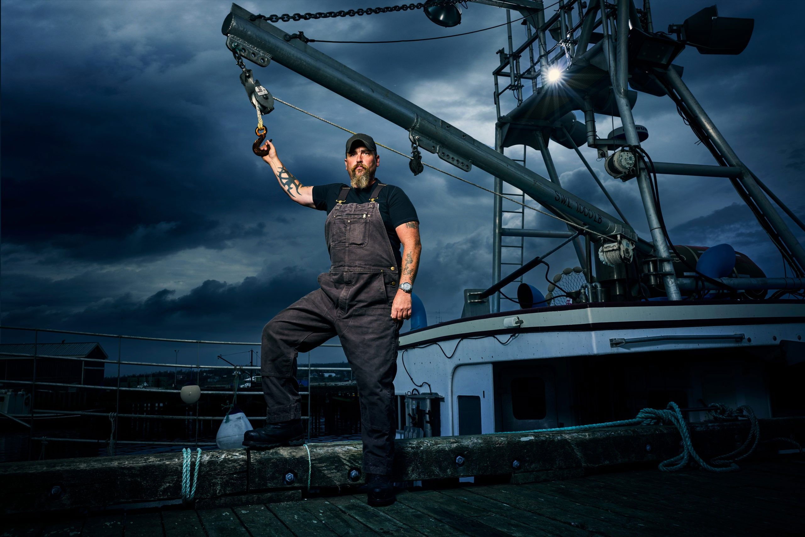McElhanney bathymetric survey professional working on a marine vessel during hydrographic data collection for The Death Coast television series.