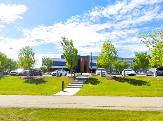 Street view of the Alberta Gaming and Liquor Distribution Centre in St. Albert, Alberta, showing the main warehouse building and surrounding area.