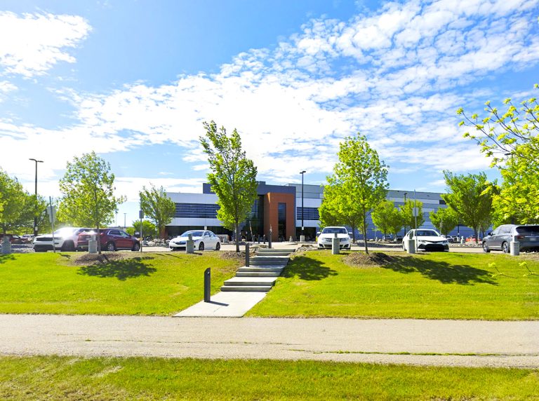 Street view of the Alberta Gaming and Liquor Distribution Centre in St. Albert, Alberta, showing the main warehouse building and surrounding area.