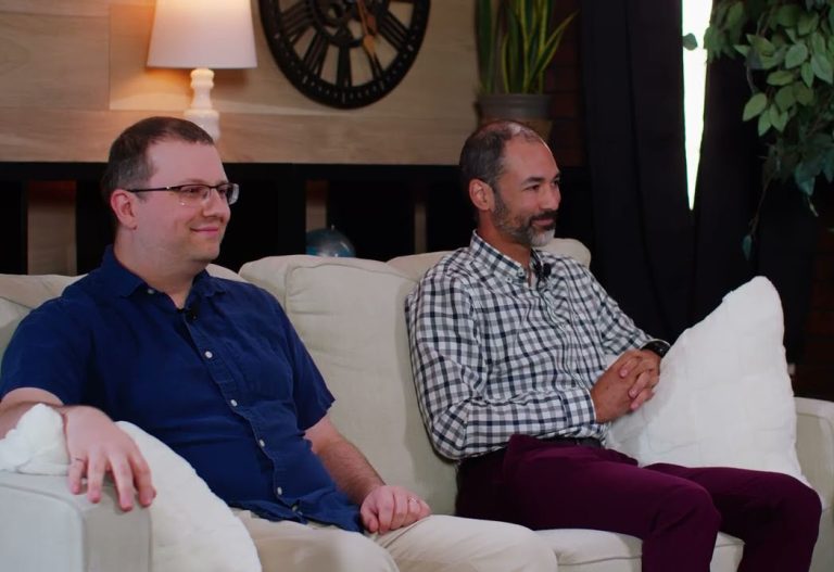 Thumbnail of UNB Live Episode 26 showing two men seated on a couch during an interview.