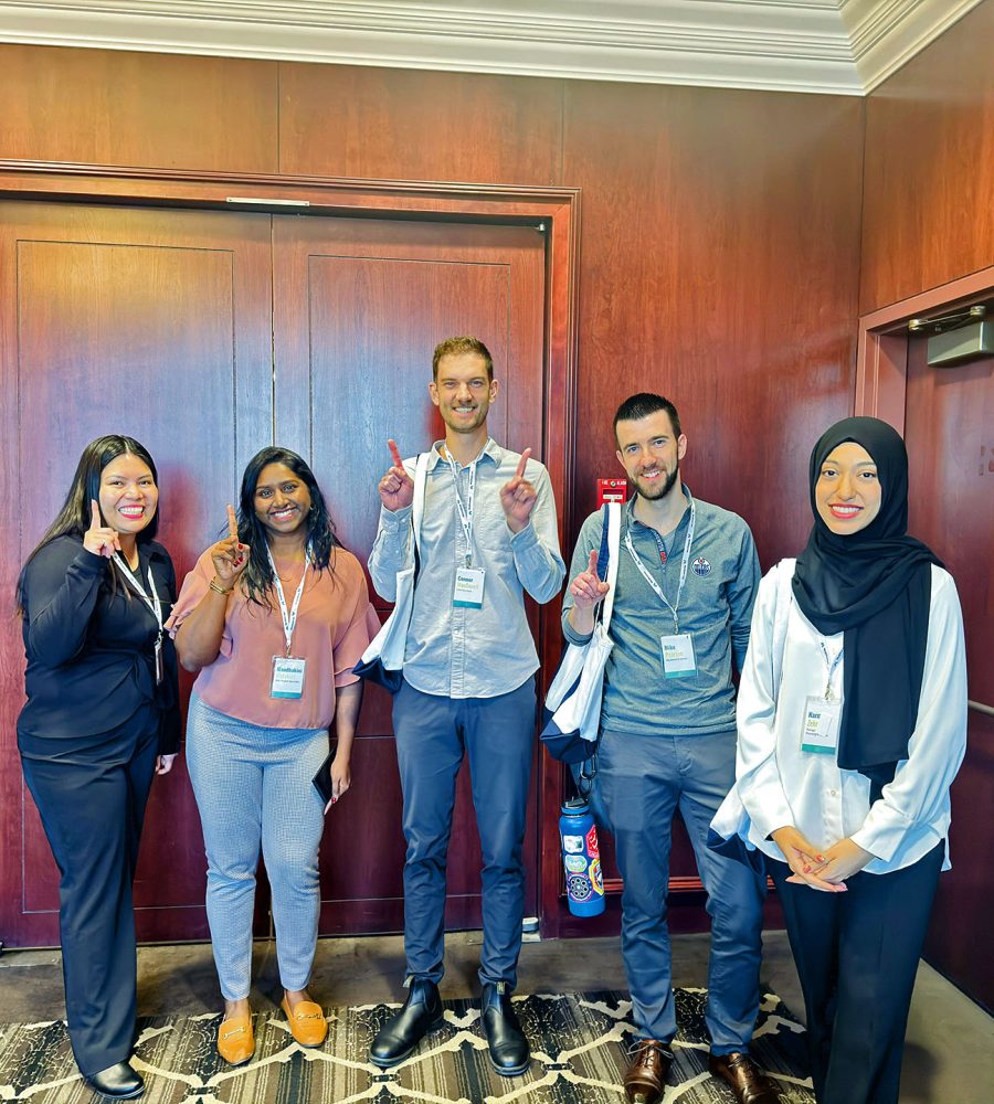 Young Professionals Program participants at a professional development event wearing conference badges.