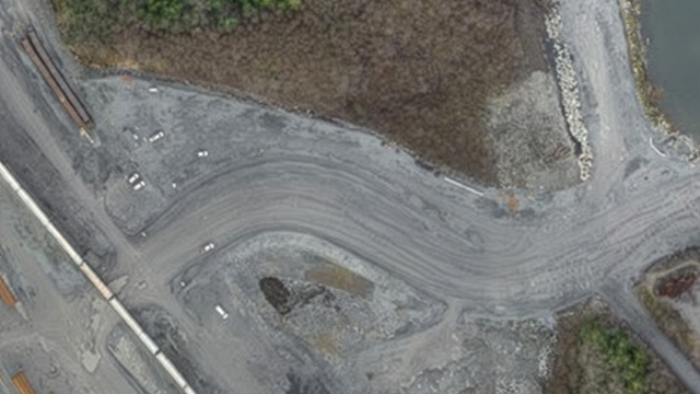 Drone aerial survey of the CanXport Intermodal Facility in Prince Rupert, BC, showing large-scale terminal development monitored with LiDAR, orthomosaic mapping, and volumetric analysis.