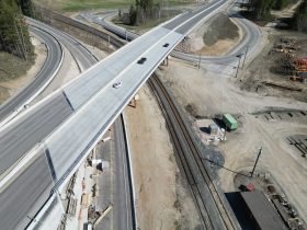 Aerial view of a new Highway 1 overpass crossing local roads and railway infrastructure as part of the Ford Road to Tappen Valley Road highway upgrades in British Columbia.