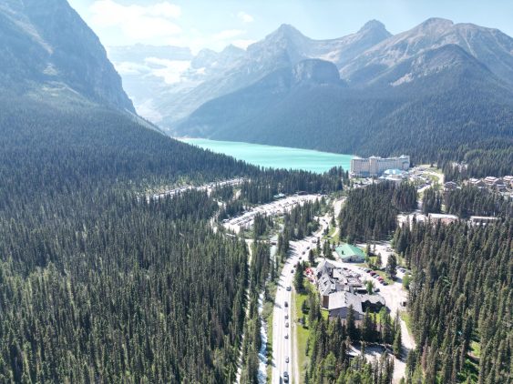 Aerial view of Lake Louise, visitor parking areas, and Fairmont Chateau Lake Louise in Banff National Park