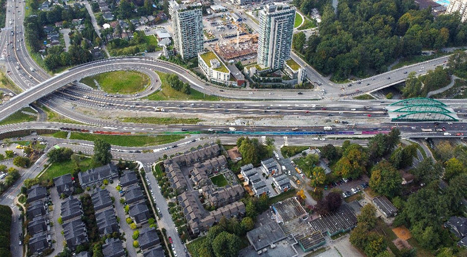 Aerial view of the Lynn Creek Bridge and surrounding Highway 1 transportation network in North Vancouver, British Columbia.